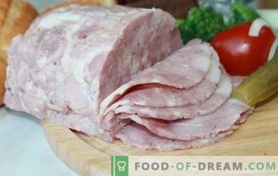 Homemade pork ham in ham with mushrooms, prunes and nuts. Baked and boiled pork ham in ham